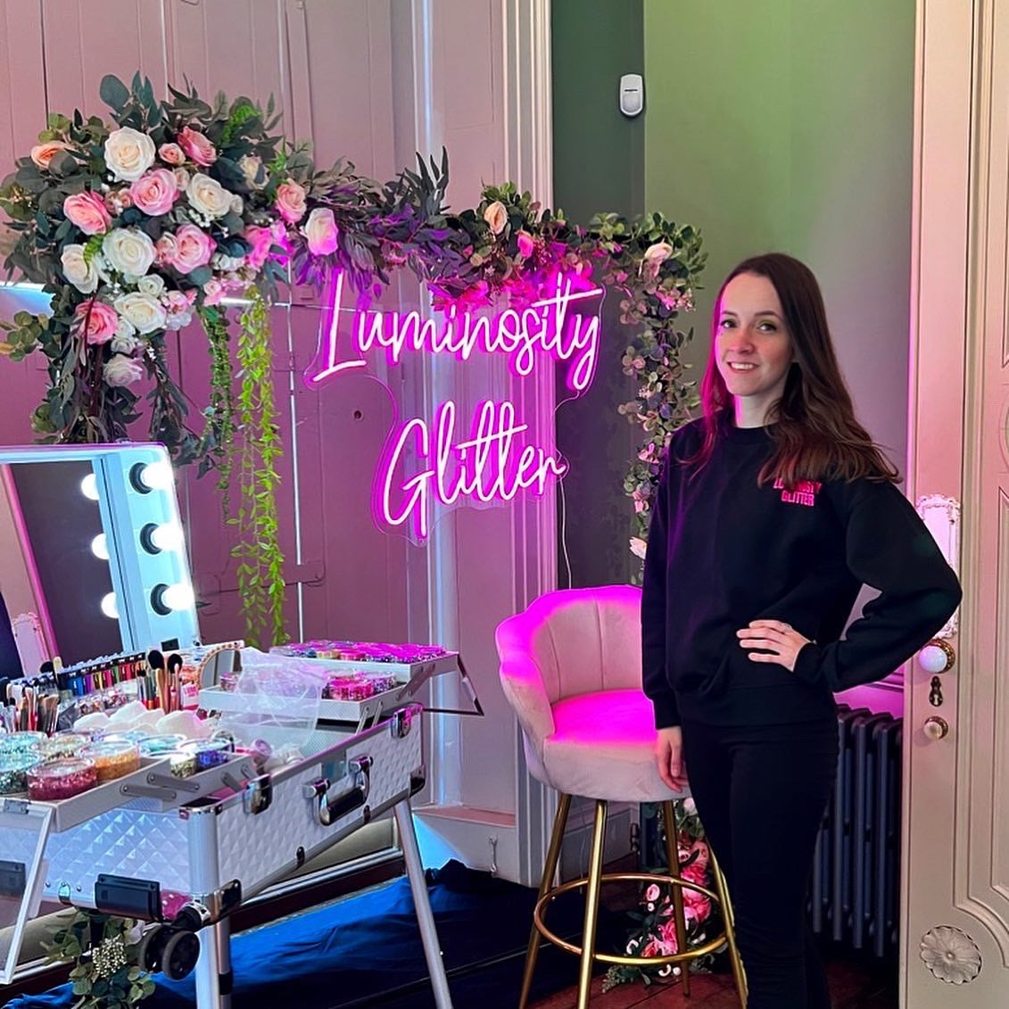 Daisy stood with Luminosity Glitter's luxury eco glitter bar at Gunnersbury Park wedding show.