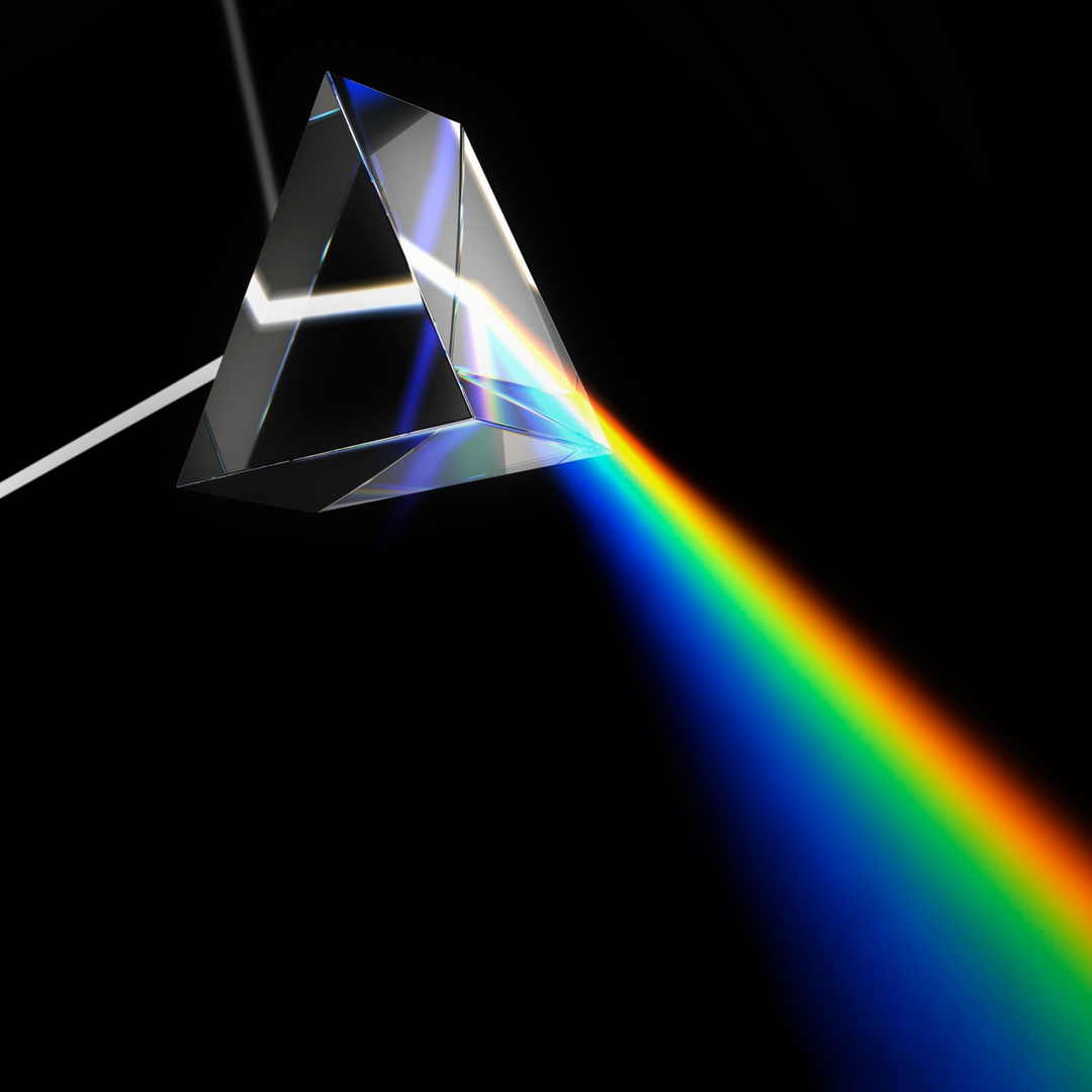 Prism with rainbow light being dispersed