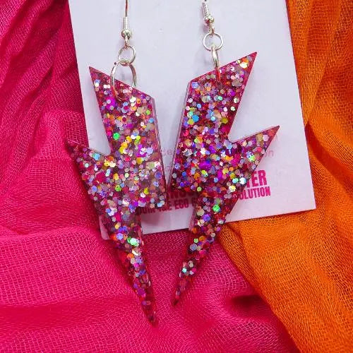 giant glitter bolt earrings in multi colour glitter shade with deep pink resin shde