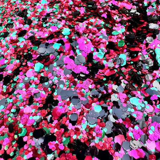 Close up of watermelon blend which is made with pink, red, green and black biodegradable glitter.