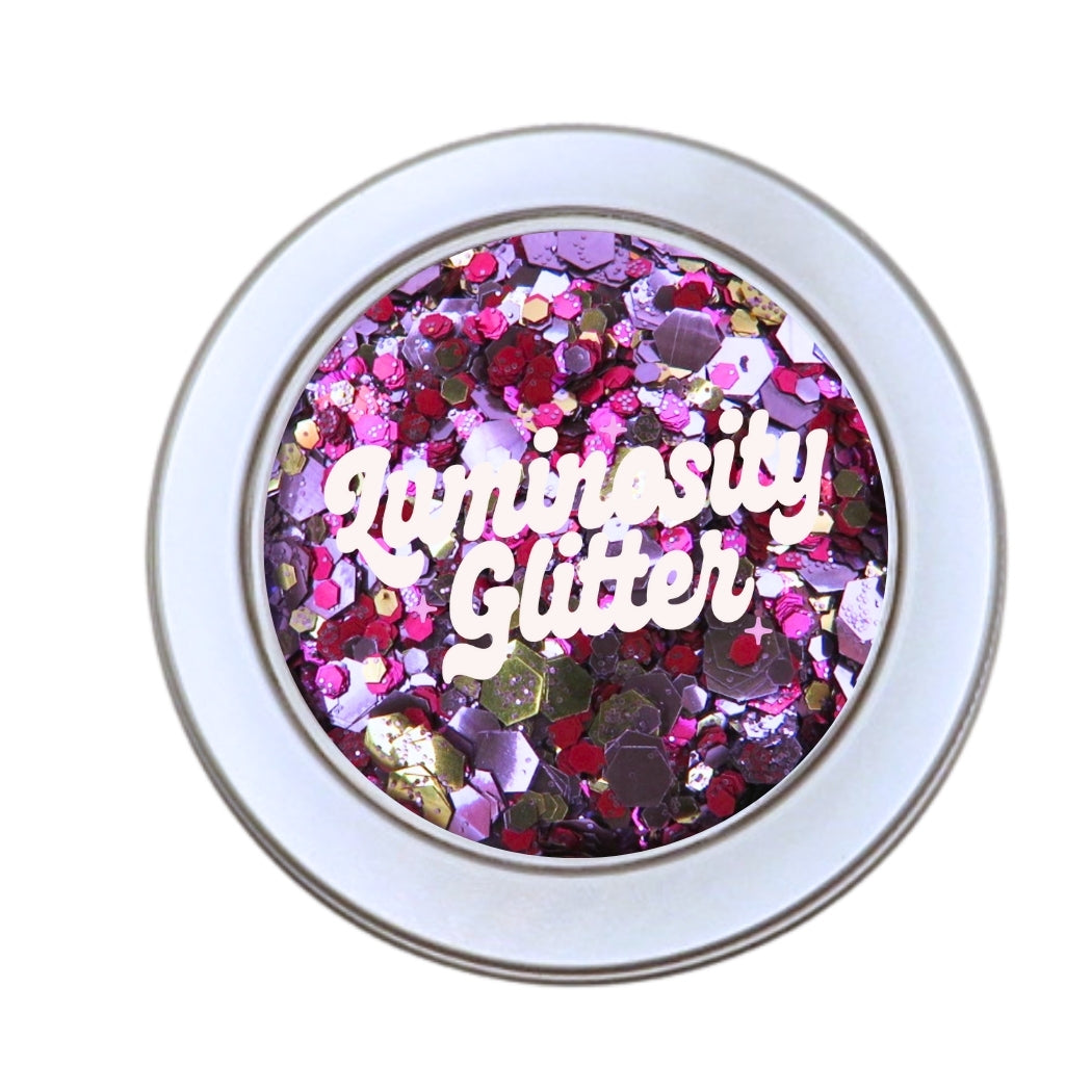 Luminosity Glitter's temptation blend. A 30 gram tin filled with the pink, purple and rose gold glitter blend.