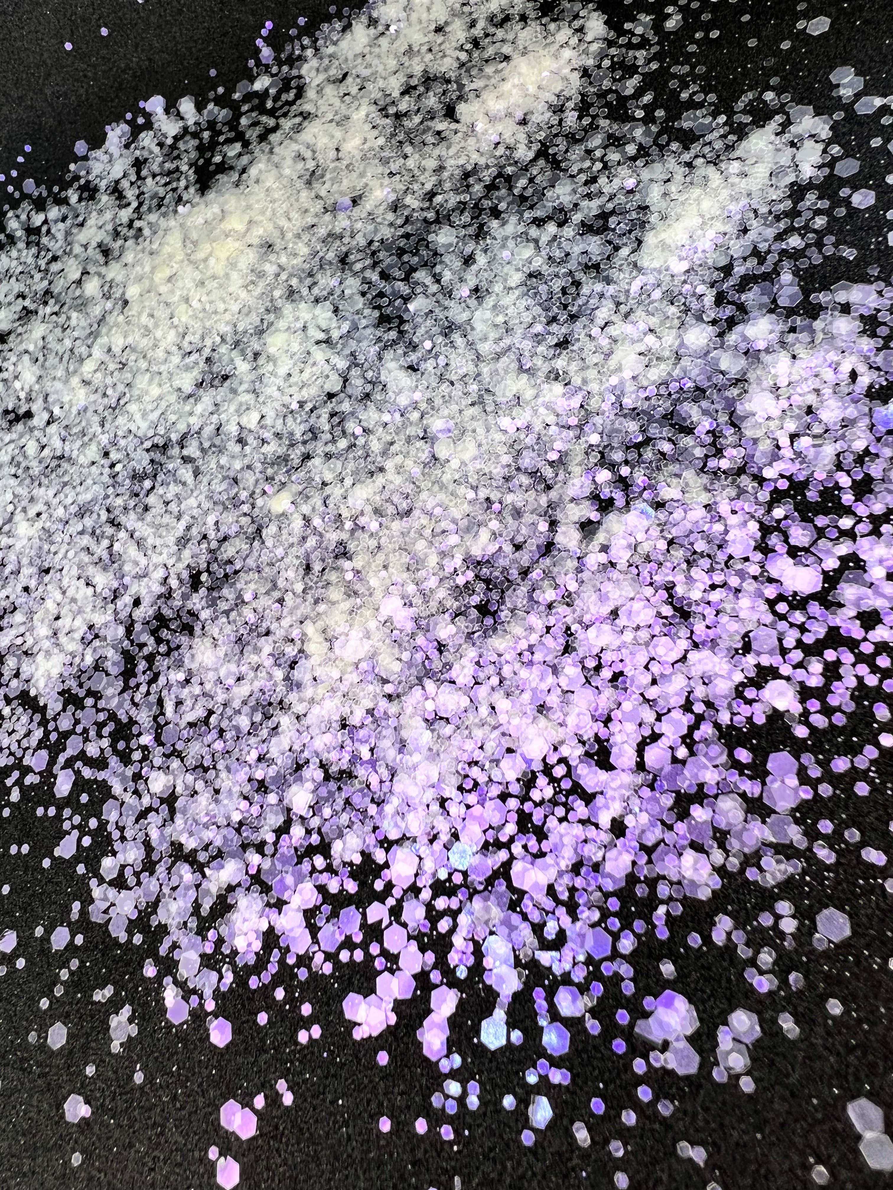Opal rose pink plastic free iridescent glitter on a black background. 100% plastic free iridescent glitter for cosmetics and soap making.