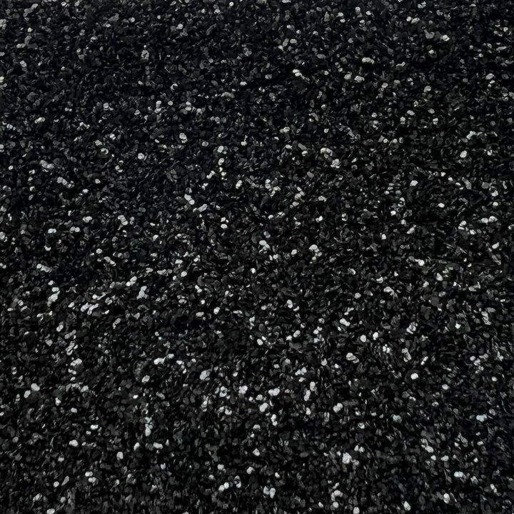 Close up of black standard biodegradable glitter by Luminosity Eco Glitter who are a London based glitter company