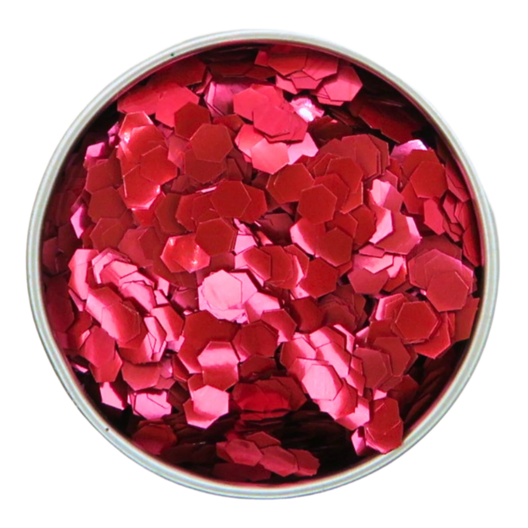 Close up of blush red super chunky eco friendly glitter in a round aluminium pot.