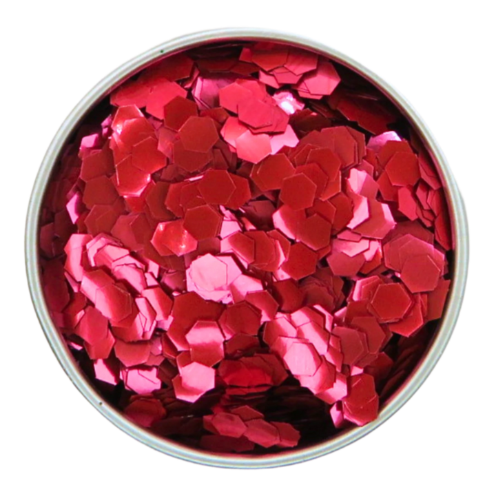 Close up of blush red super chunky eco friendly glitter in a round aluminium pot.