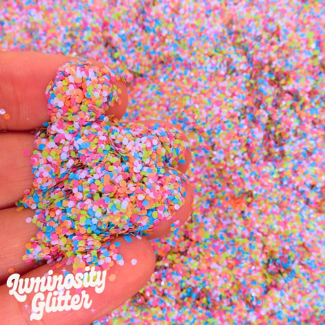 Calypso eco glitter mix is a multi colour glitter mix made with biodegradable and vegan friendly glitter in pink, orange, purple, blue and green chunky glitter.