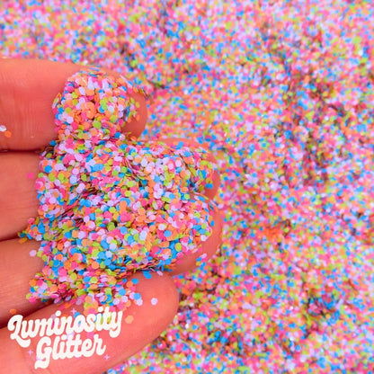 Calypso eco glitter mix is a multi colour glitter mix made with biodegradable and vegan friendly glitter in pink, orange, purple, blue and green chunky glitter.