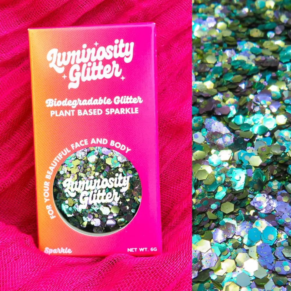 A green, purple and gold glitter mix presented in a beautiful pink and orange ombre box.