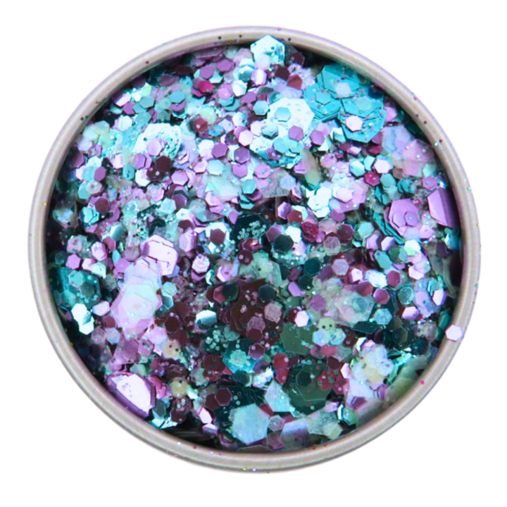 Galaxy glitter blend. A close up image of the mix which is made with turquoise, purple and opalescent mix of pink, blue and green in fine, chunky and super chunky sizing.