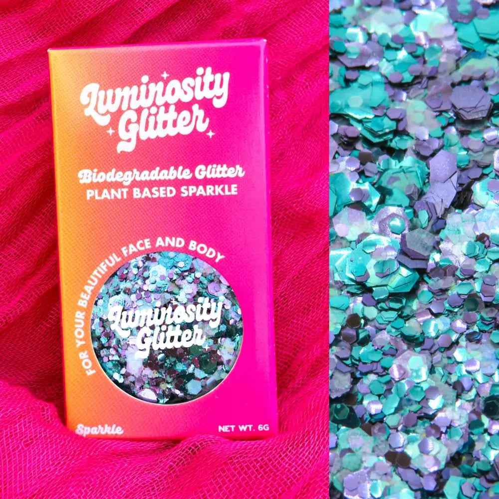 Galaxy eco glitter in bright ombre packaging. The glitter comes in a round 6 gram aluminium tin that is refillable.