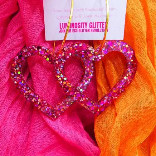 glitter hoop earrings in love heart shape with glitter.