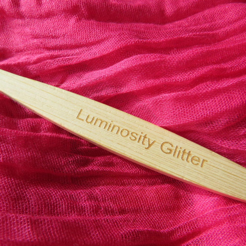 luminosity glitter branded bamboo toothbrush for applying hair and beard glitter