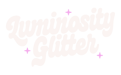 Luminosity Glitter white logo with pink sparkles