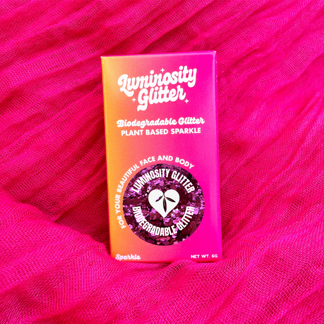 Magenta stormy rose blend of biodegradable glitter in cardboard packaging in bright colours.