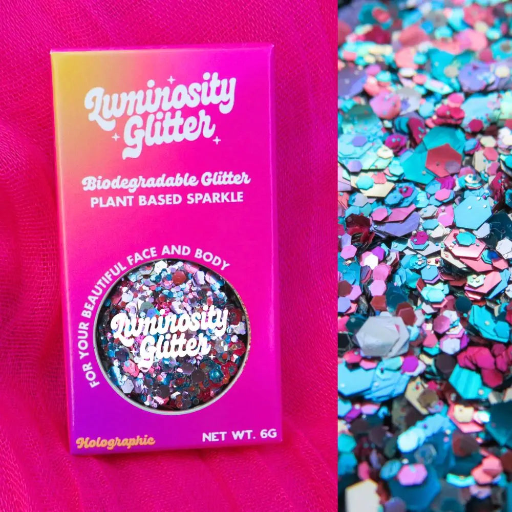 Mermaid biodegradable holographic glitter mix in a bright pink, purple and orange ombre packaging box.