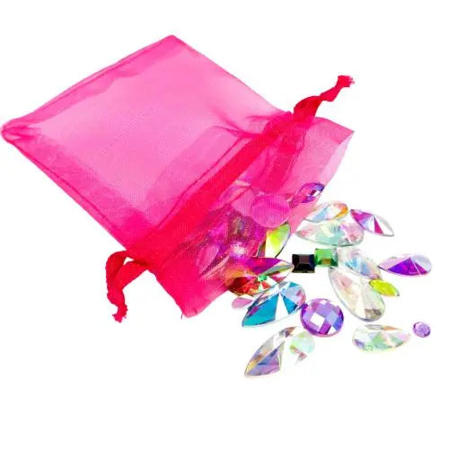 A hot pink organza bag filled with reusable face and body gems for festivals and makeup. Apply with a cosmetic fixative such as glitter glue or eyelash glue