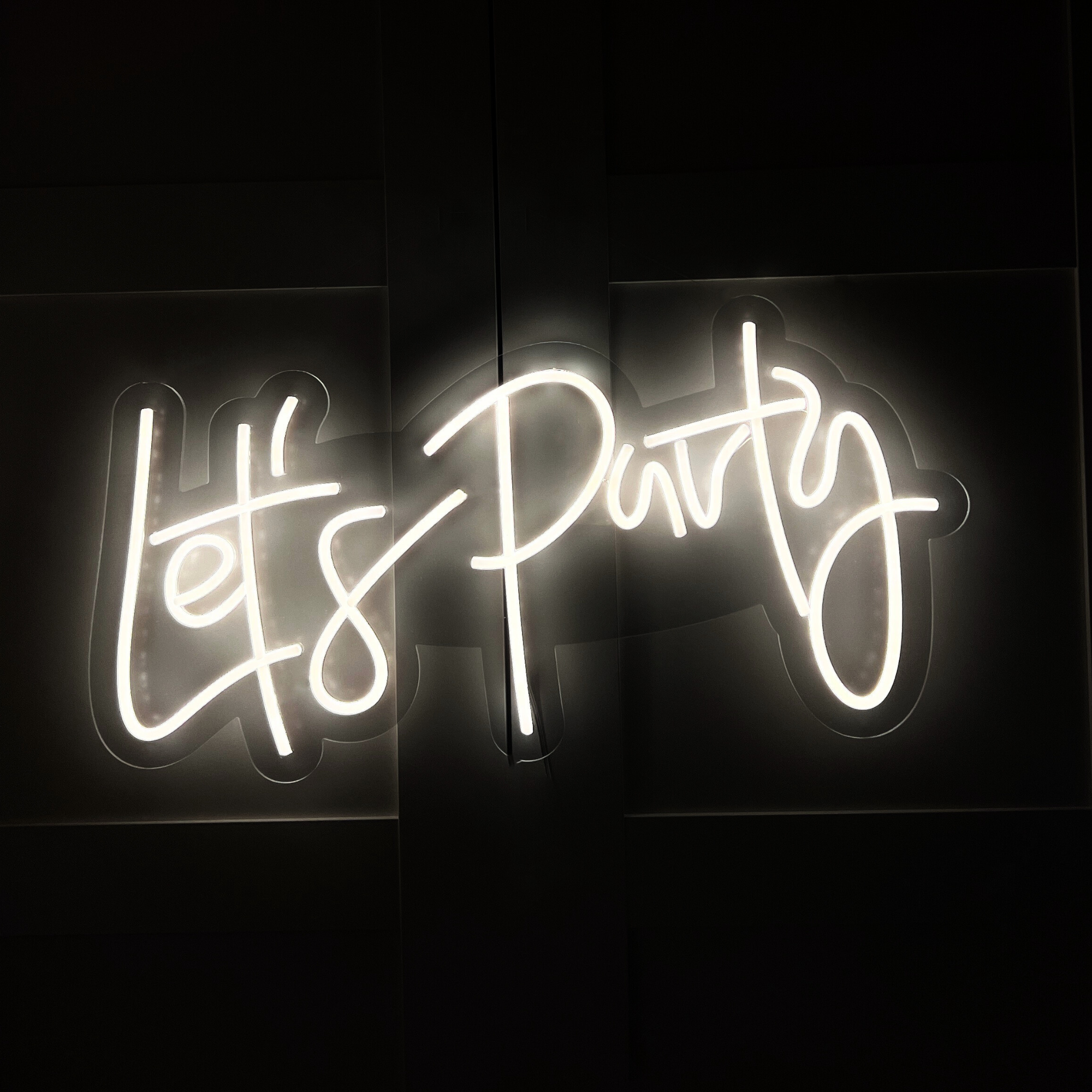 Neon sign hire saying Let's Party for events in London