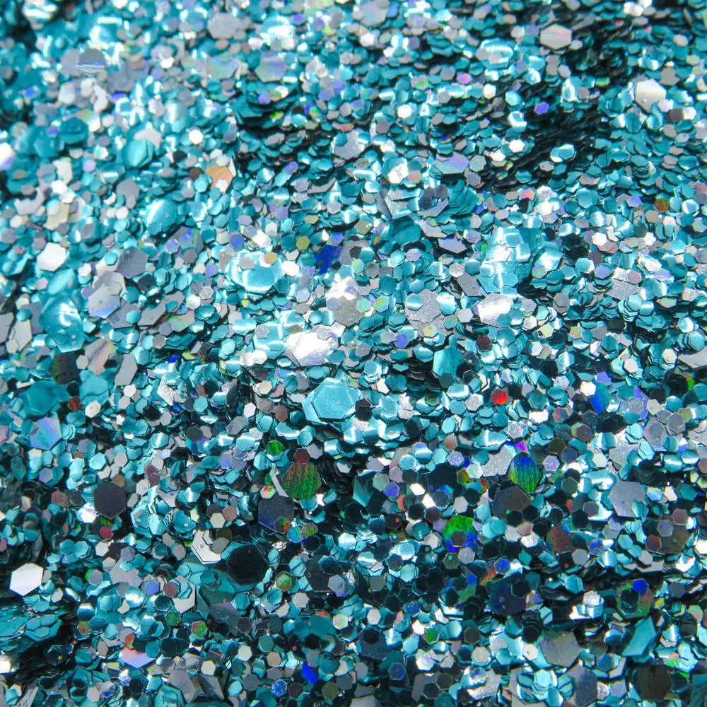 Close up of ocean crush glitter blend of turquoise and silver holographic eco friendly glitter.