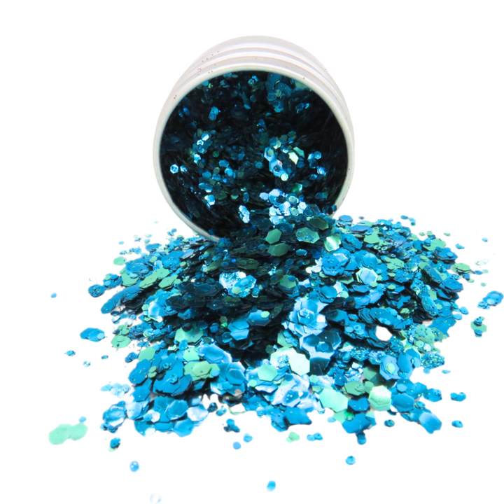 Ocean blue, green and turquoise biodegradable cosmetic glitter in an aluminium pot.