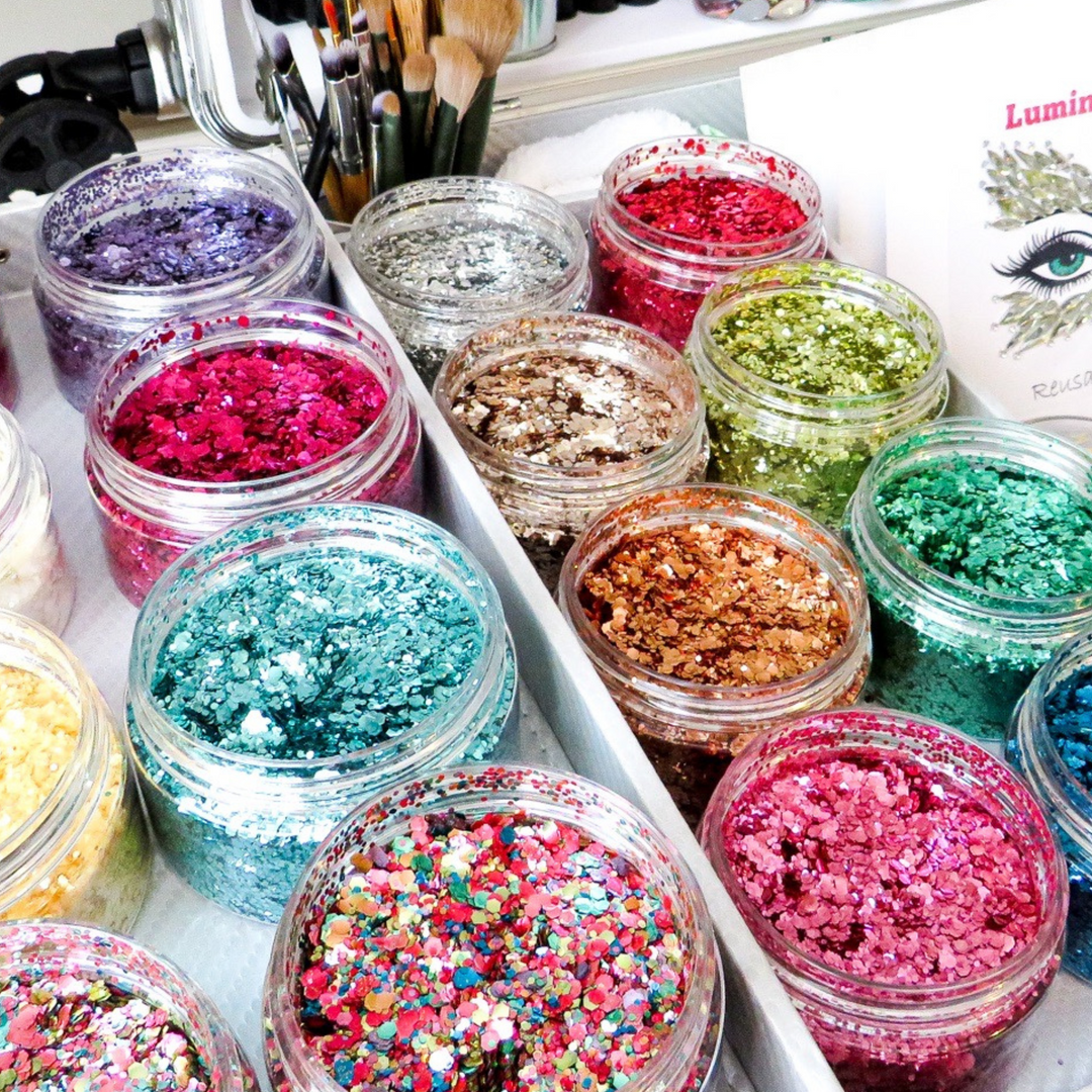 Close up of large pots filled with biodegradable glitter by Luminosity Glitter for luxury eco glitter bars