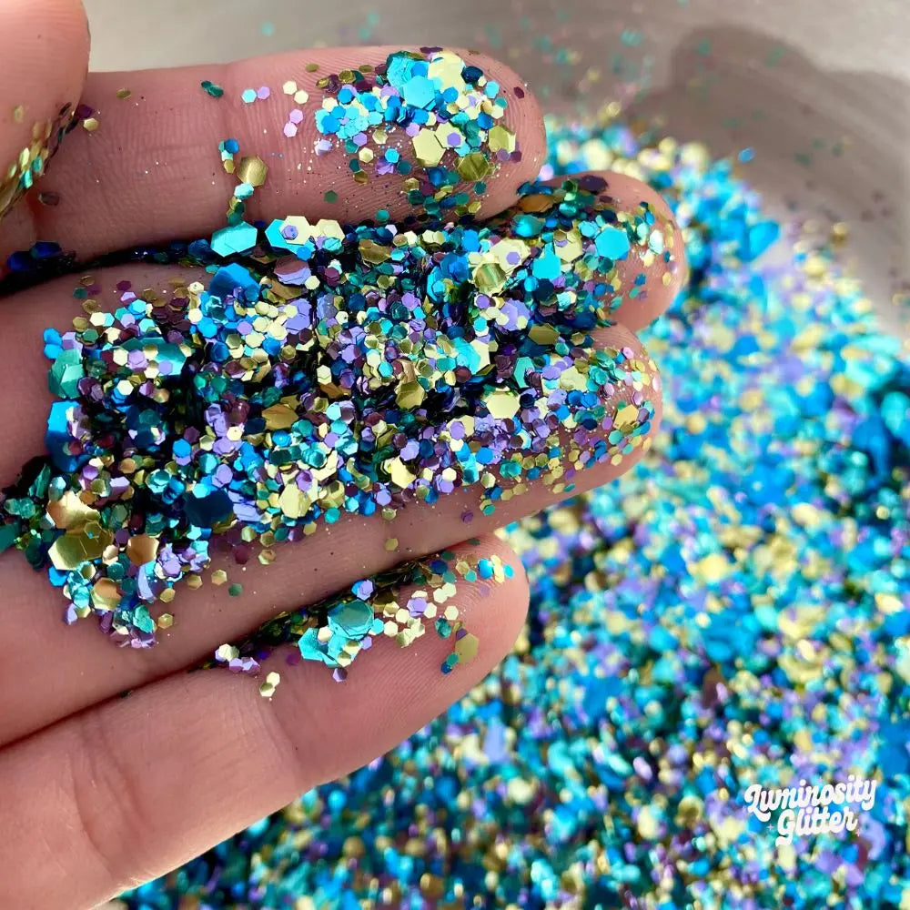 Peacock eco friendly glitter mix by Luminosity Glitter with shades of blue, turquoise and gold.