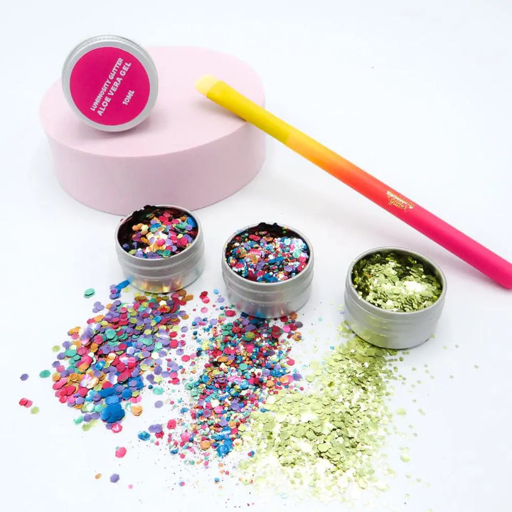 Rainbow burst eco glitter set with three pots of biodegradable glitter, a full sized makeup and glitter application brush and a 10ml pot of aloe vera application gel.