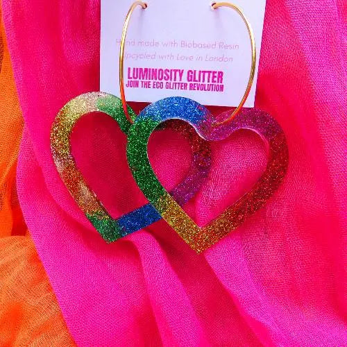 Rainbow glitter hoop XL earrings on gold hoops.