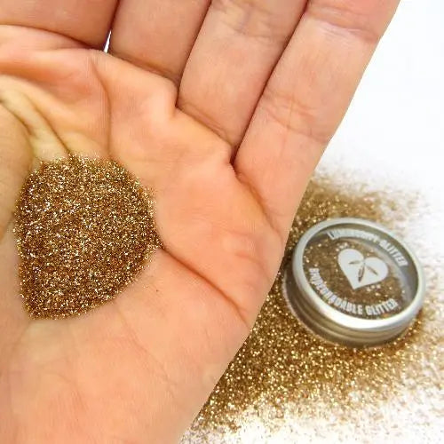 Rose gold fine biodegradable cosmetic glitter. Autumnal warm gold shade of glitter.