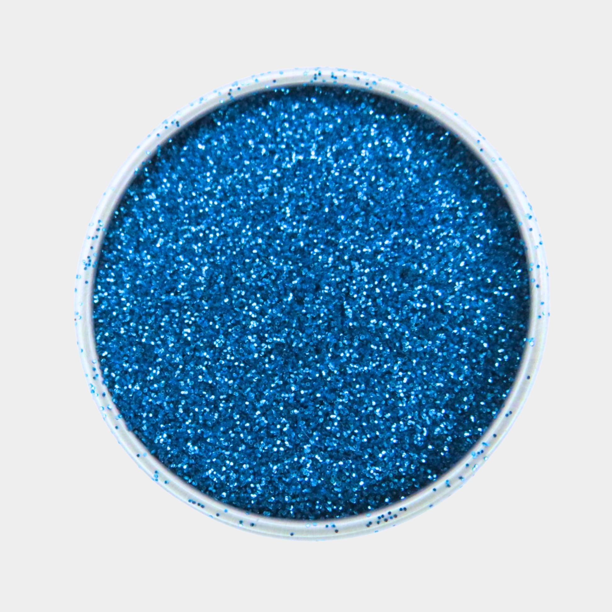 Blue glitter in a small round container on a light gray background