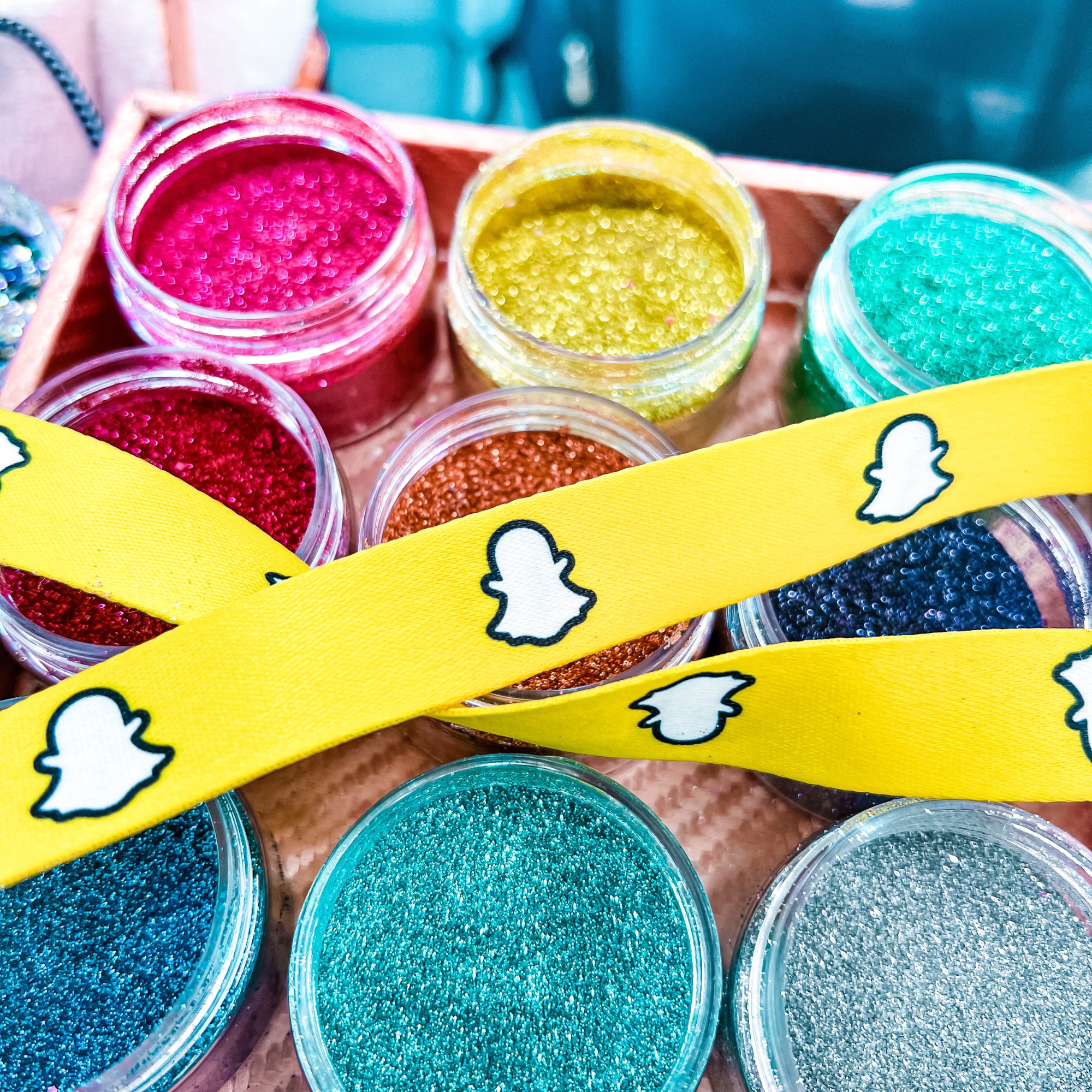 Eco glitter brand activations by Luminosity glitter with the snapchat logo on a lanyard for a corporate event