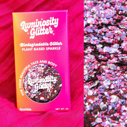 sweetheart pink, purple and silver eco friendly glitter mix by Luminosity Glitter in bright and bold pink and orange ombre packaging.