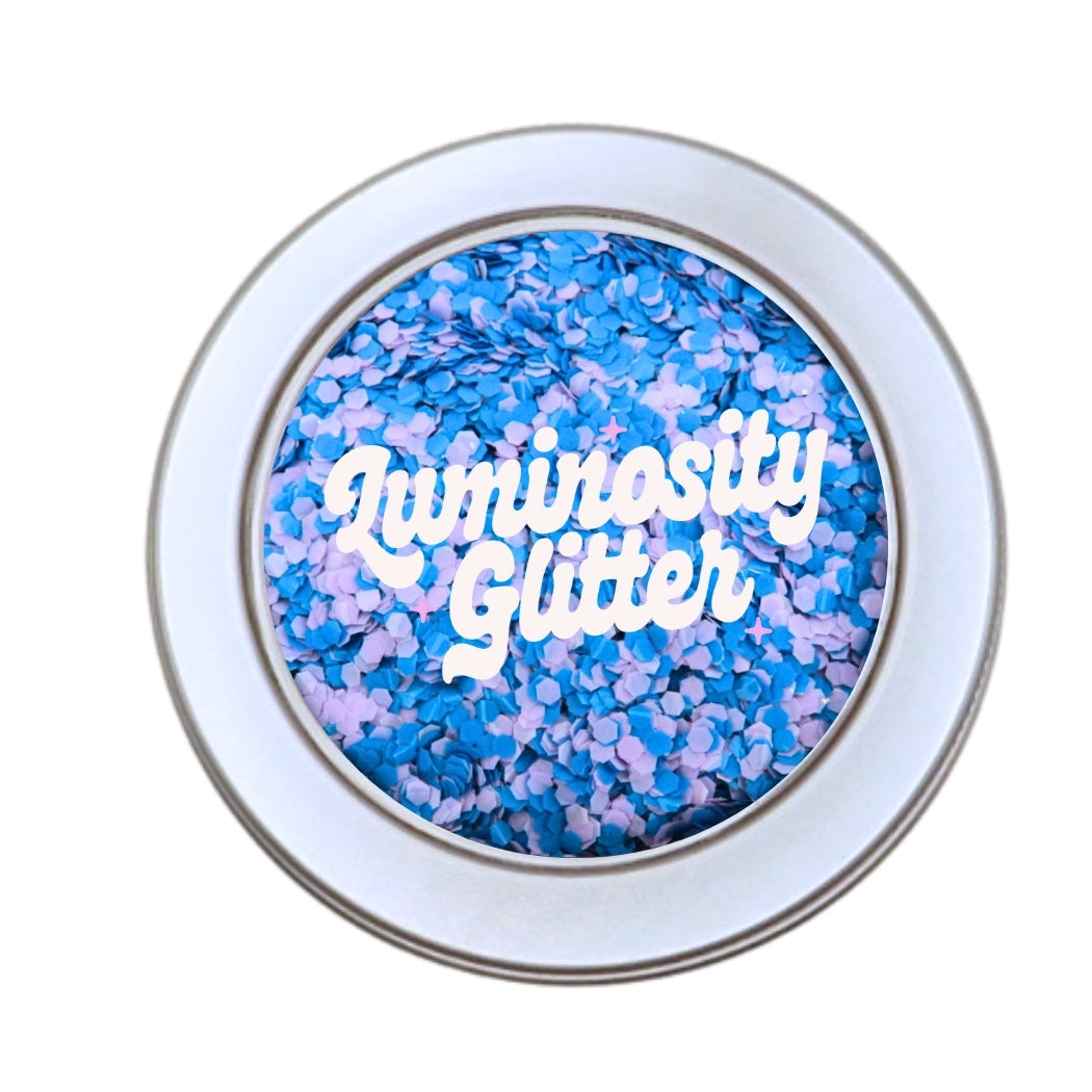 Tranquility blend of blue and purple opaque biodegradable glitter in a 30 gram aluminium pot.