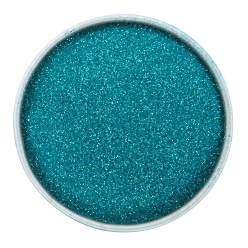 A round container filled with bright turquoise ultra-fine glitter, viewed from above