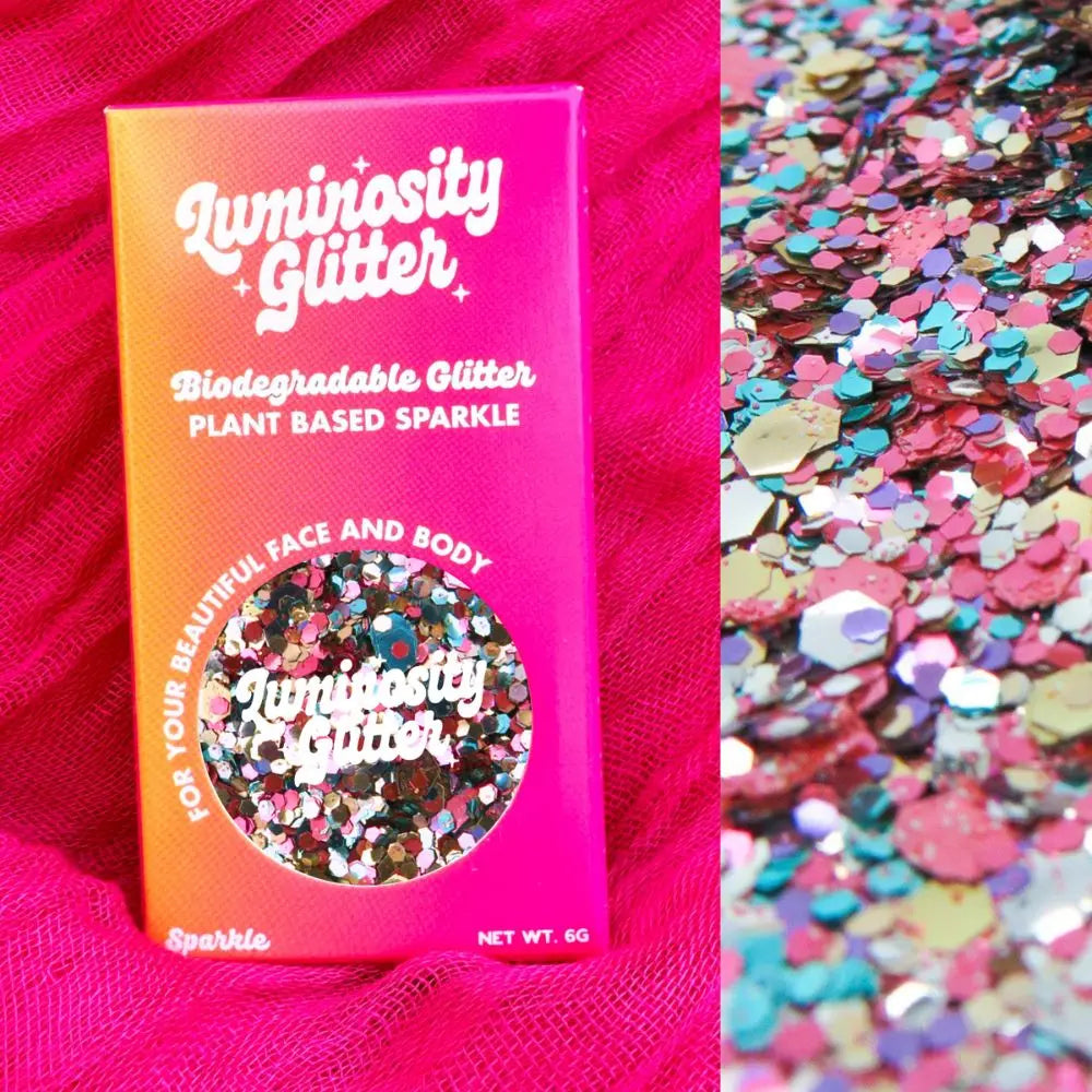 Unicorn biodegradable glitter blend in bright ombre packaging in an orange and hot pink shade.