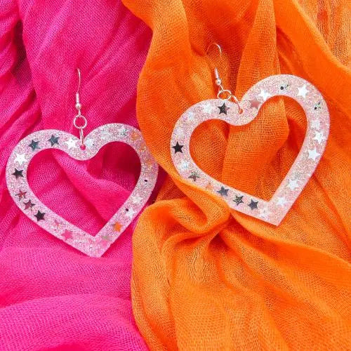 White glitter XL love heart earrings with silver stars in.