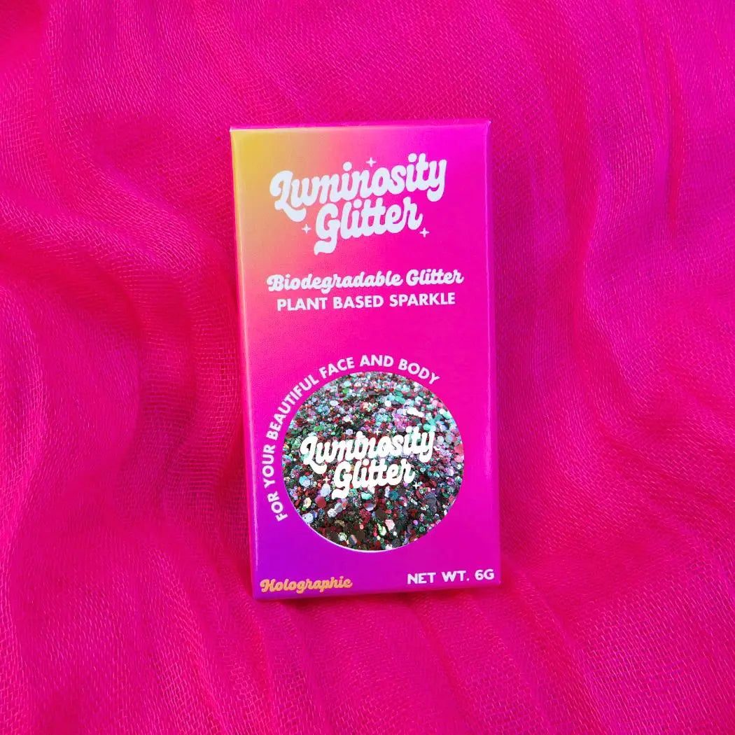 witches brew holographic biodegradable glitter blend in a 6g pot and bright product packaging for halloween.