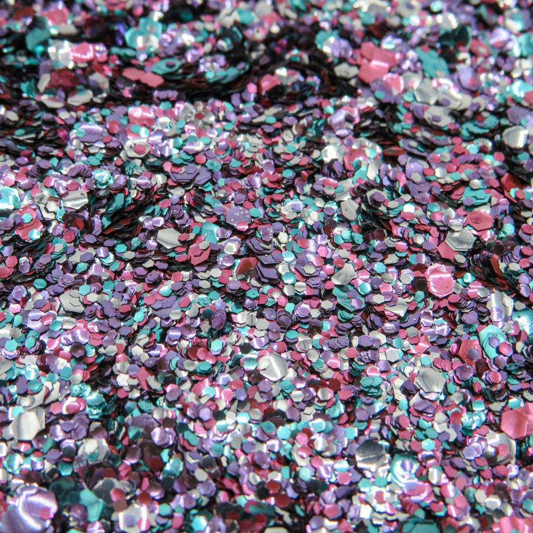 Lyra eco glitter blend made with pink, silver, turquoise and purple biodegradable cosmetic glitter for makeup
