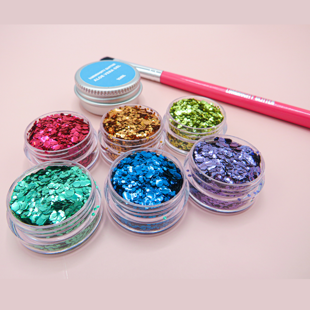 Baby love eco glitter set for pride makeup including a hot pink makeup brush and aloe vera application gel