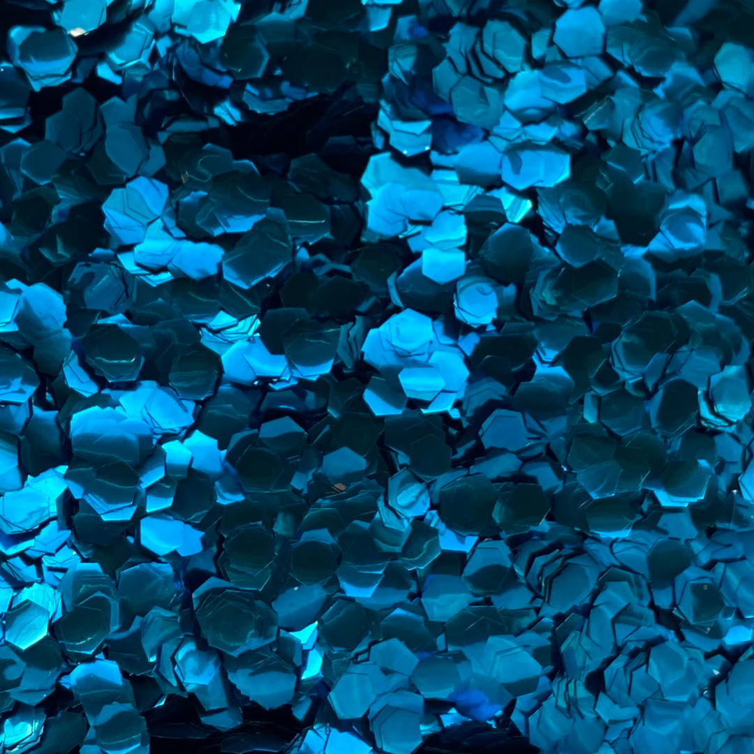Close up of Luminosity Glitters blue ultra chunky cosmetic glitter