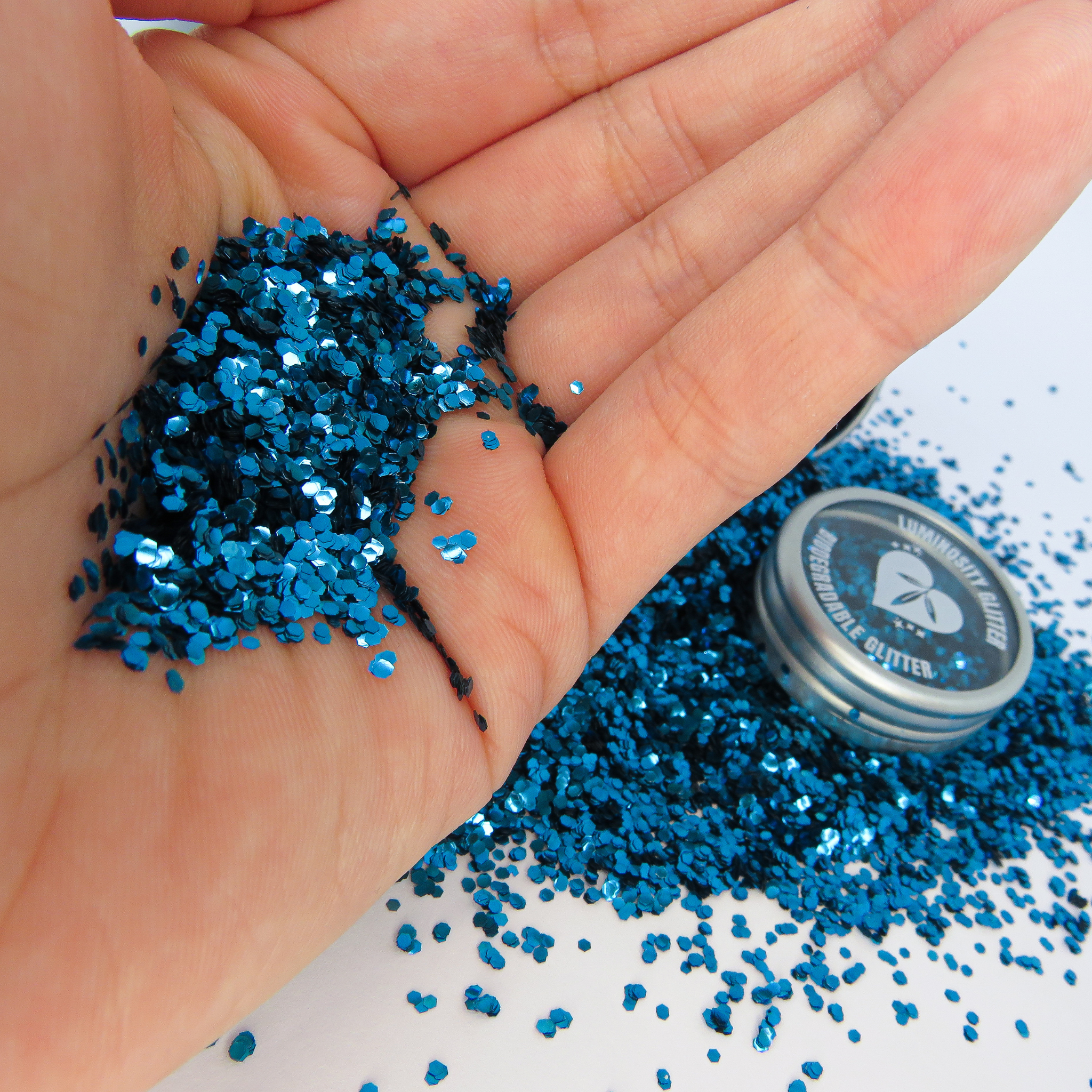 Cobalt blue chunky eco glitter on a caucasian hand by Luminosity Glitter