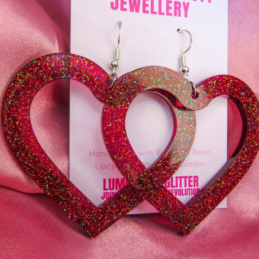 Giant glittery firework earrings in a love heart shape by Luminosity Glitter as part of their non-bioglitter amnesty