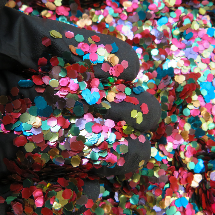 Close up of funfetti eco glitter mix in ultra chunky hexagonal shapes
