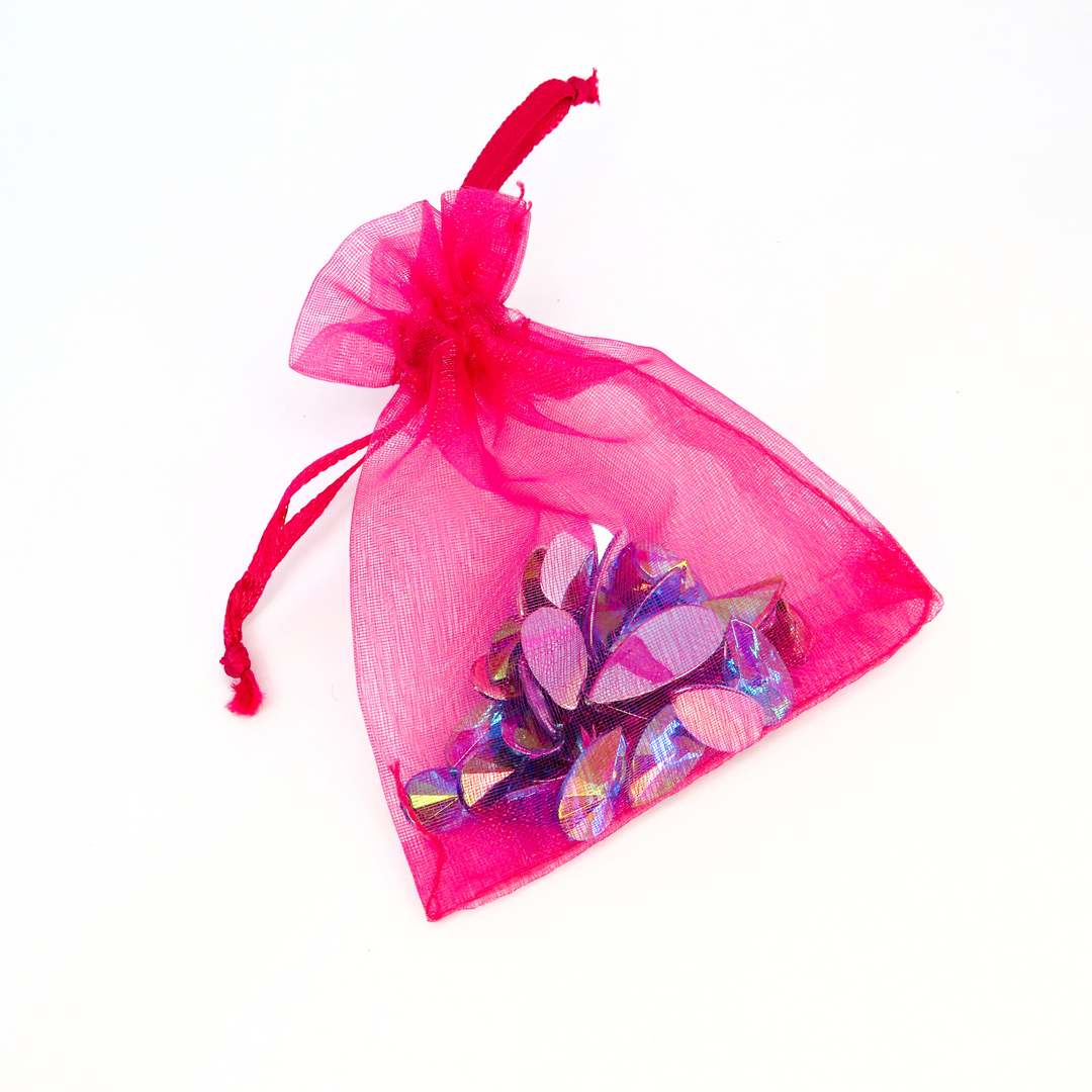 Ice blue festival face gems in a pink organza bag by Luminosity Glitter. Reusable and designed to be kept safe in their little bag after use.