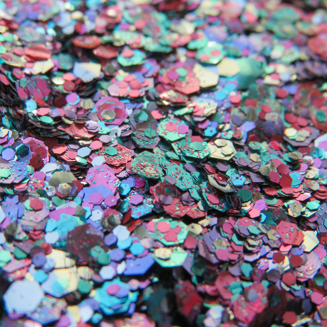 Lyra eco glitter blend by Luminosity Glitter. A close up of a glitter mxi made with turquoise, pink, purple and silver biodegradable glitter.
