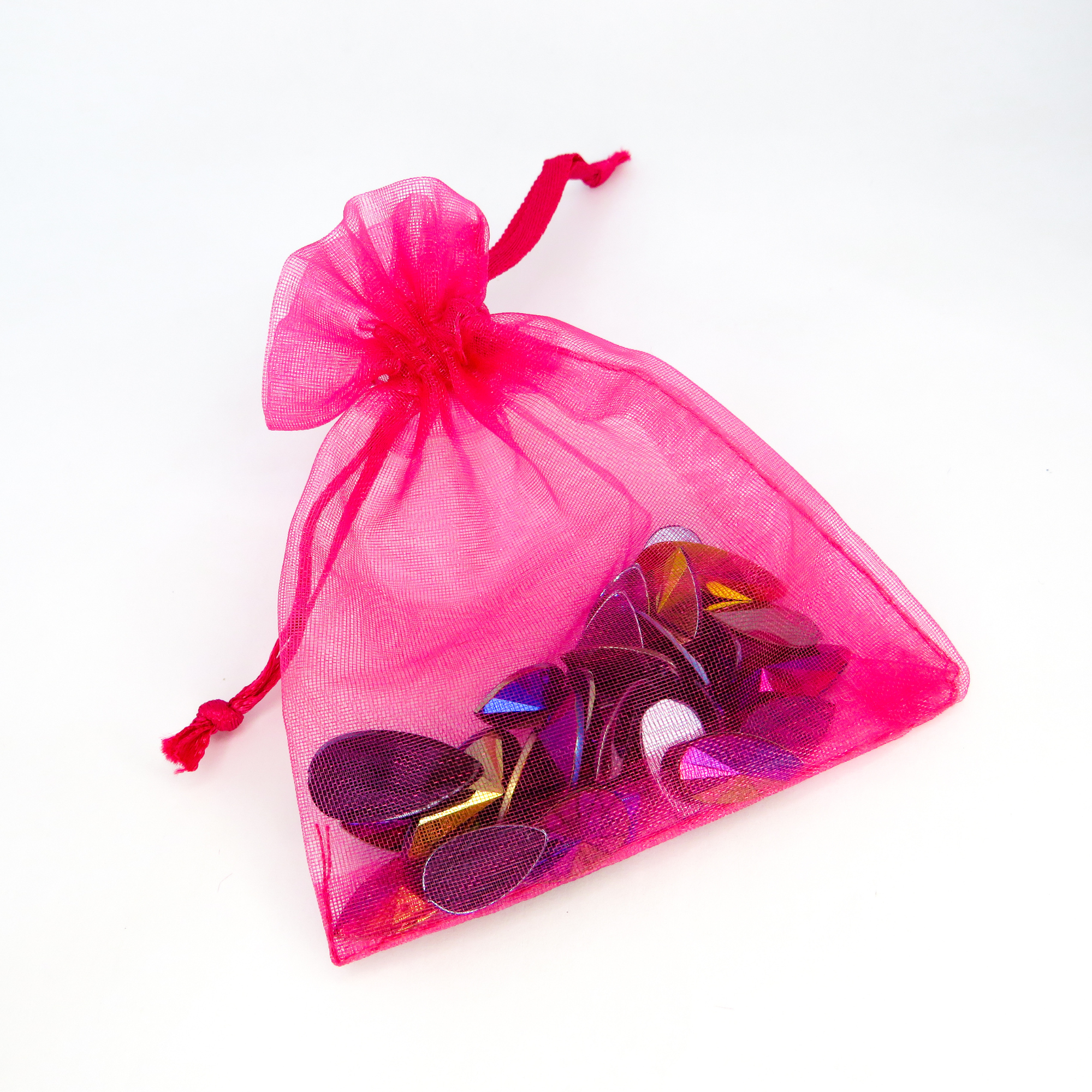 Maverick reusable festival face and body gems by Luminosity Glitter in a mini hot pink organza bag to keep them safe after use