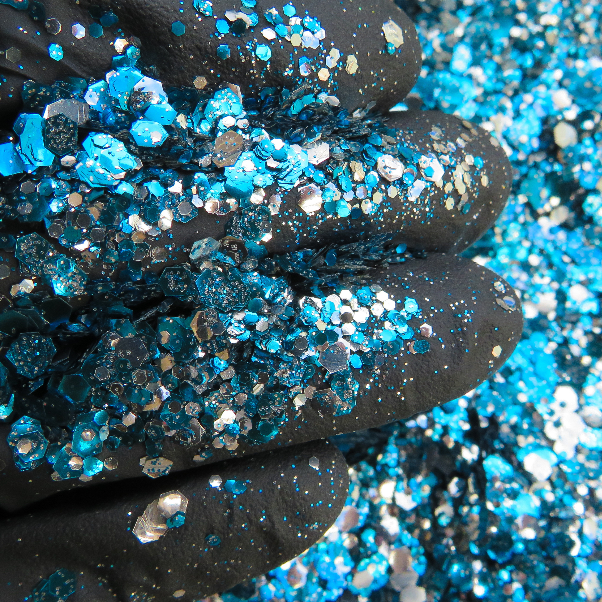 Moon river biodegradable glitter close up on a black glove