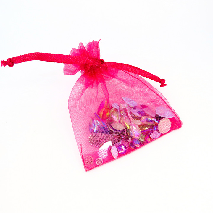 Multi mix festival face and body gems by Luminosity glitter. Come in a handy pink organza bag to keep them safe after use