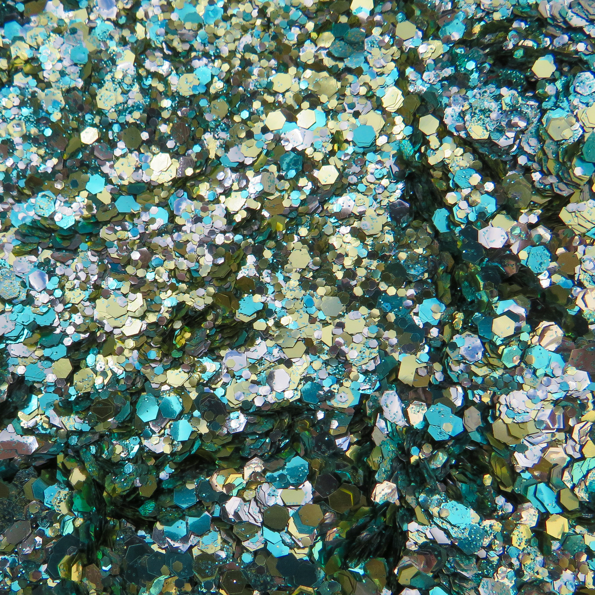 Pineapple Kisses blend of turquoise, gold and silver biodegradable glitter. A tropical and summery cosmetic glitter blend