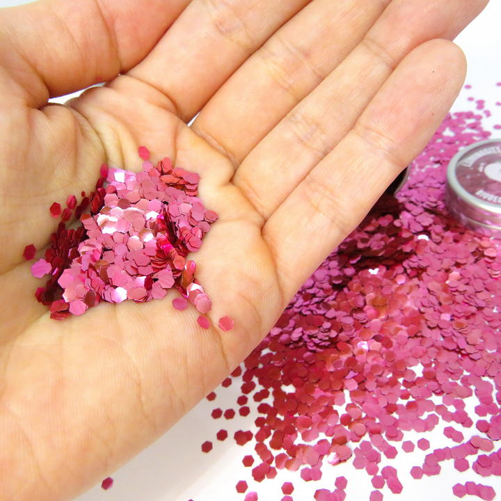 Rose pink ultra chunky biodegradable glitter by Luminosity Glitter for your face, hair, nails and body art.
