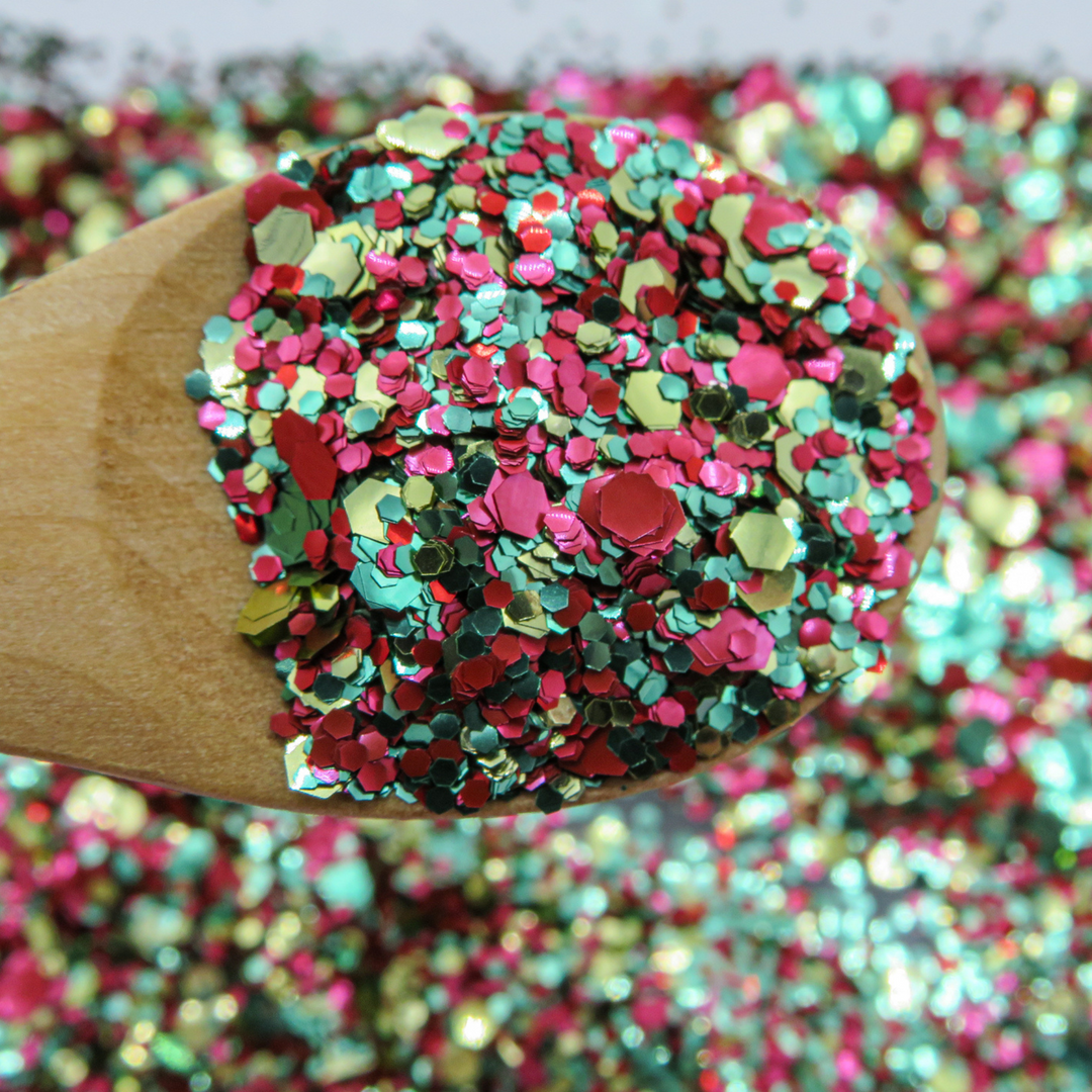 Red, gold and green eco glitter mixed together by Luminosity Glitter to create the Reggae River Blend